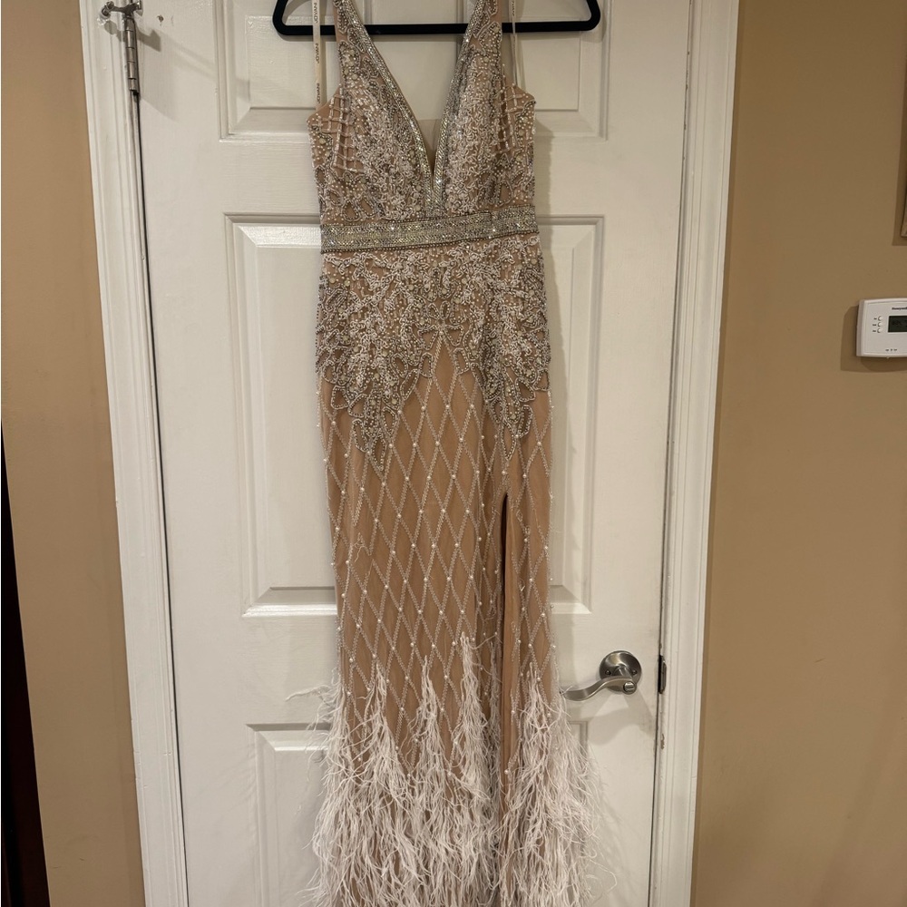 Elegant Beaded Gown with Feather Hem